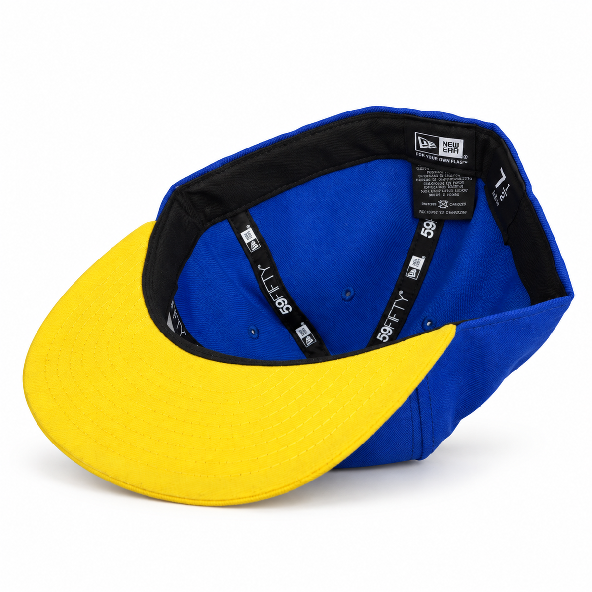 Blue and yellow tree fitted hat interior view