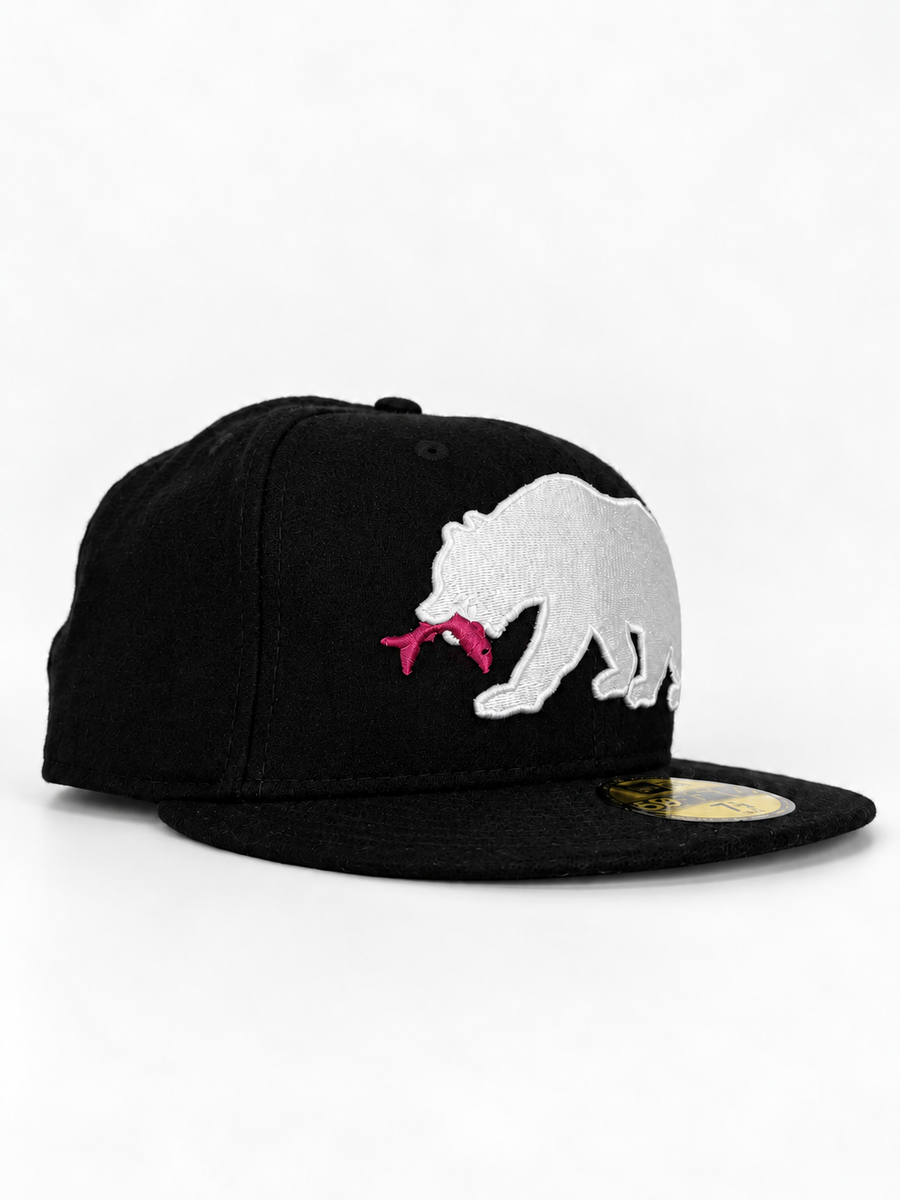 CaliBear and Salmon black wool New Era fitted with white bear and pink fish — three-quarter view