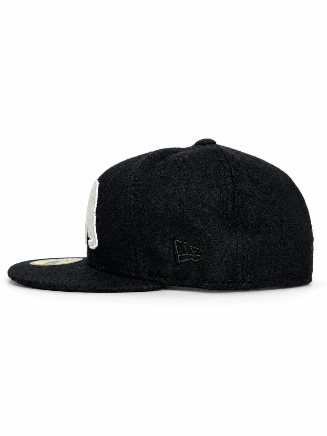 CaliBear and Salmon black wool New Era fitted with white bear and pink fish — New Era side view