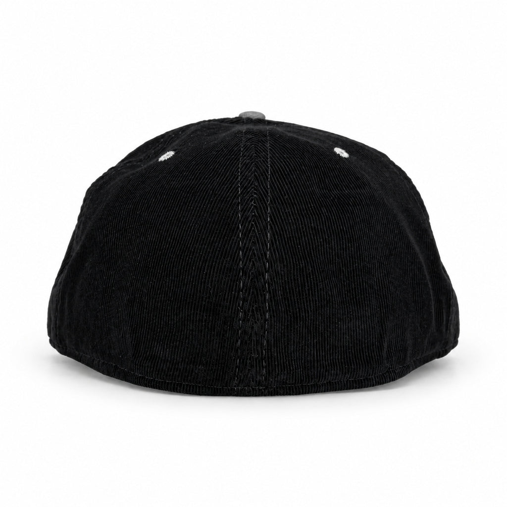 Black corduroy fitted Yofi hat with white embroidery, back view