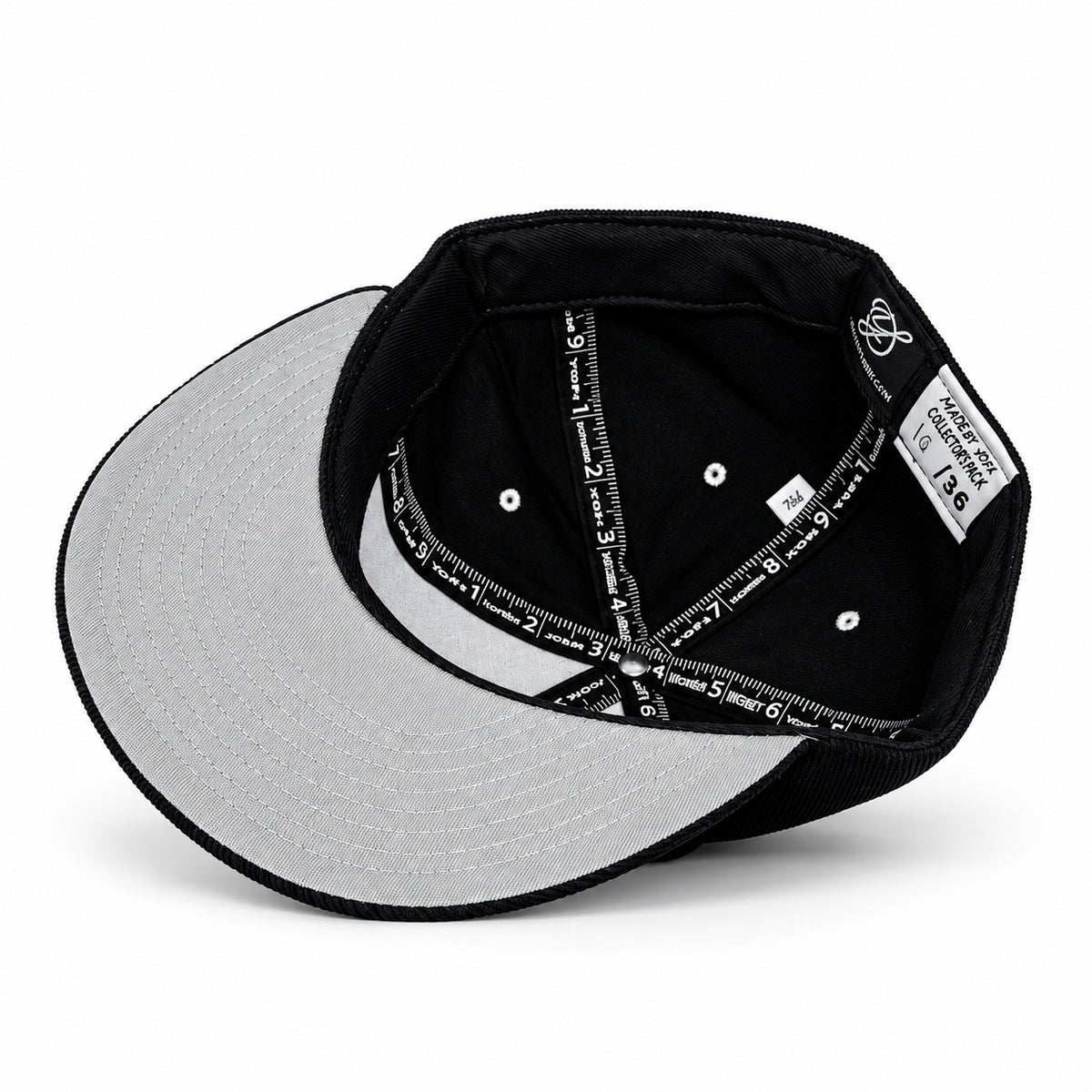 Black corduroy fitted Yofi hat with white embroidery, interior angle view