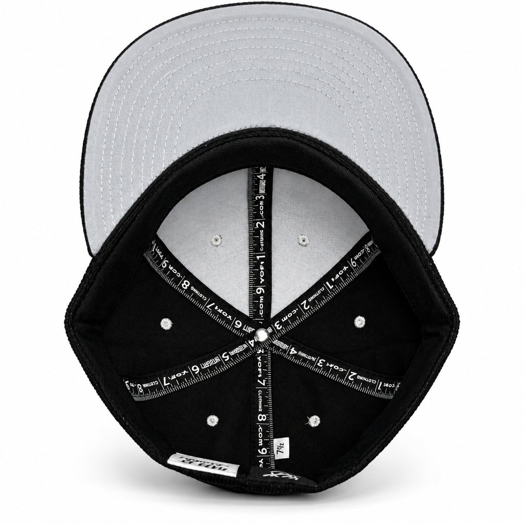 Black corduroy fitted Yofi hat with white embroidery, interior view