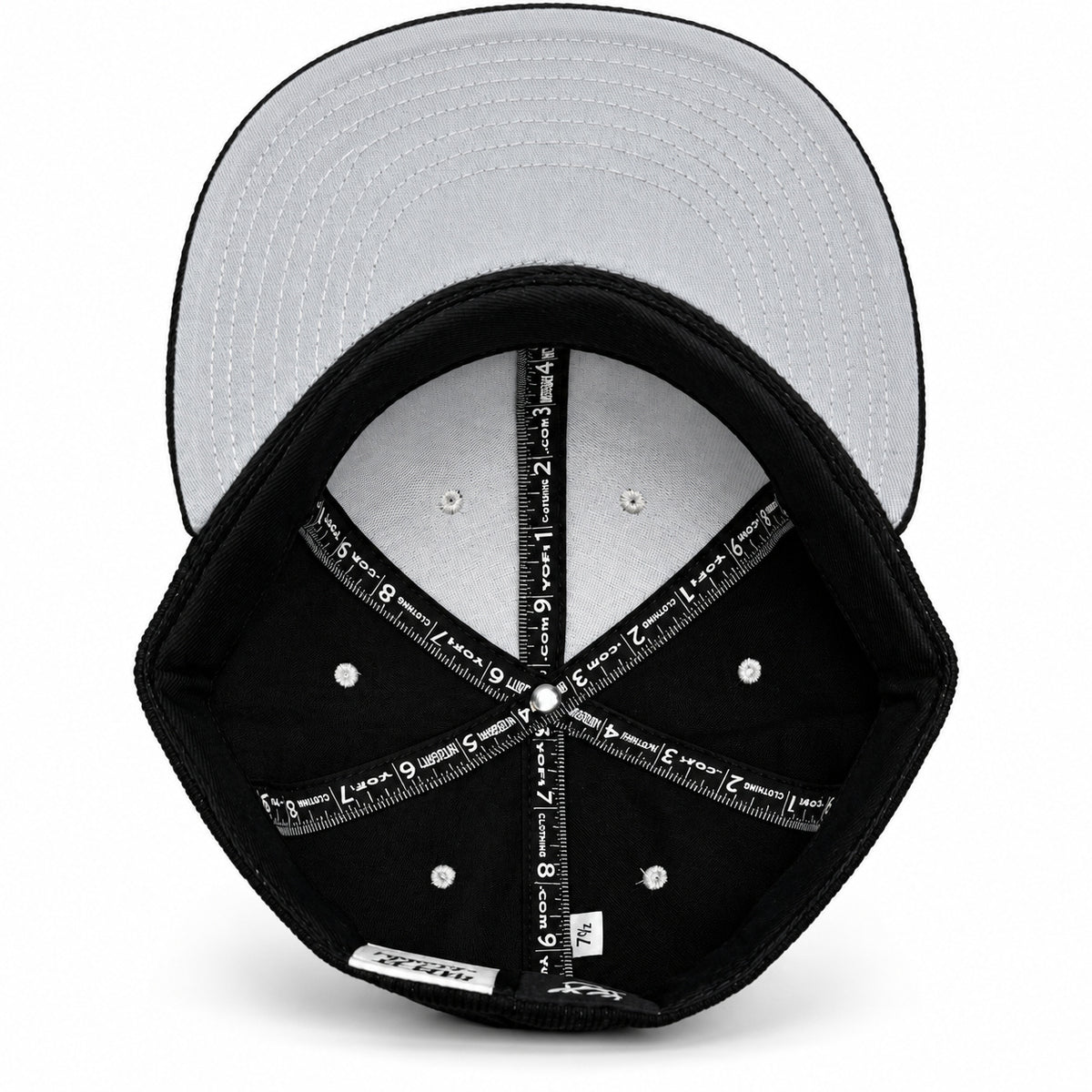 Black corduroy fitted Yofi hat with white embroidery, interior view