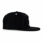 Black corduroy fitted Yofi hat with white embroidery, side view