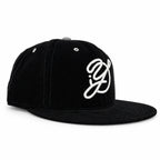 Black corduroy fitted Yofi hat with white embroidery, three quarter view