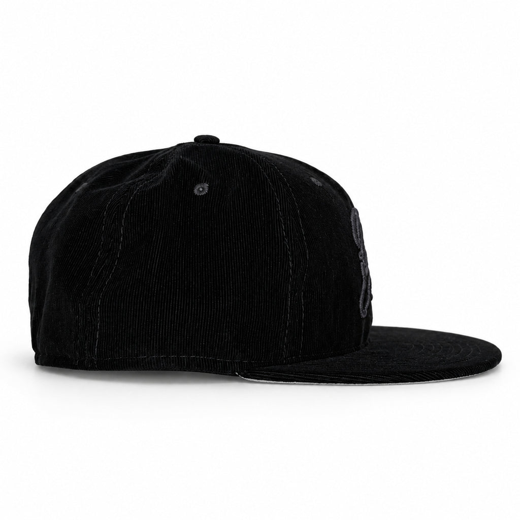 Black-on-black corduroy Yofi fitted hat, side view