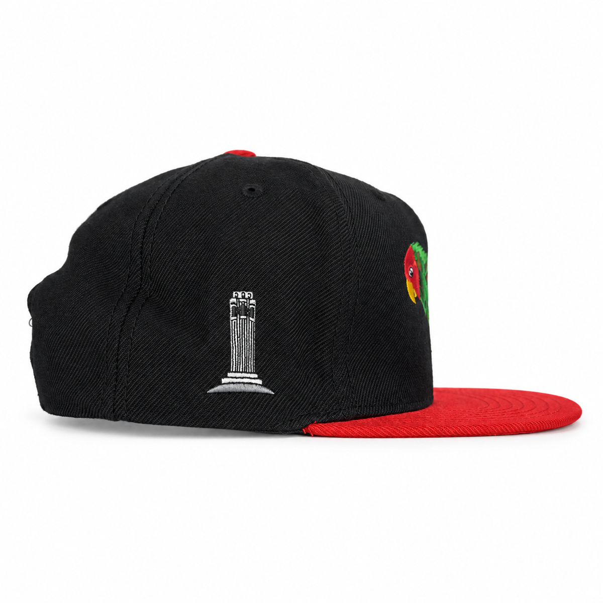 Side view showing Coit Tower embroidery and red brim